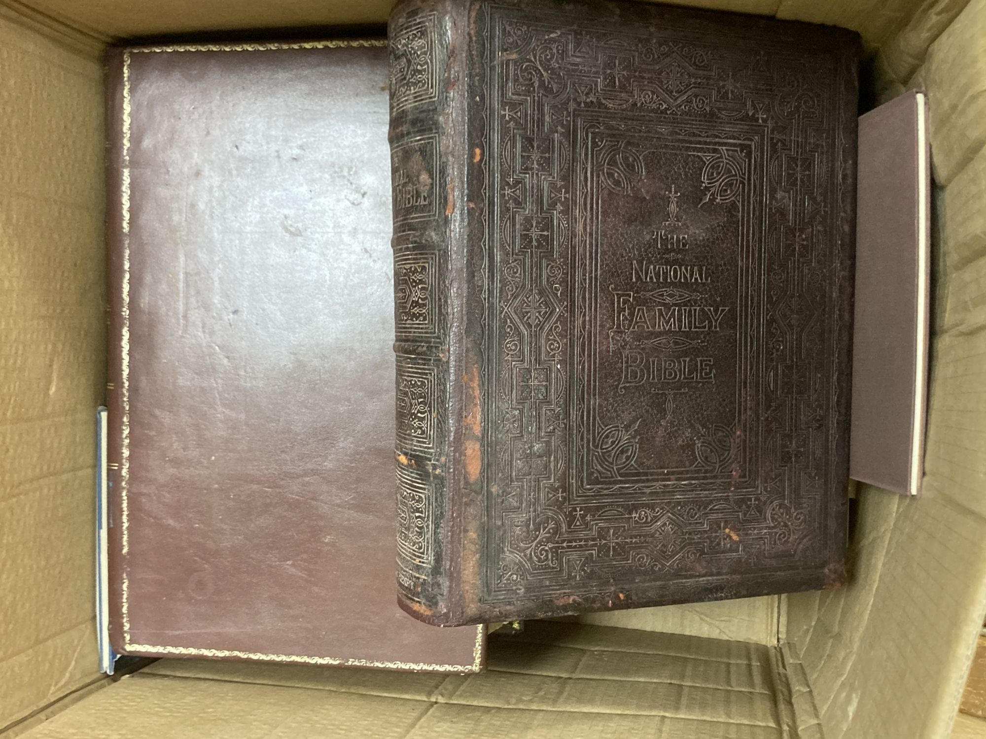 A collection of books, including bibles, childrens, Sussex-related, HMSO, etc.